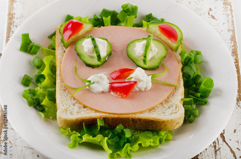 Breakfast with smiling toast and fresh vegetables. Top view
