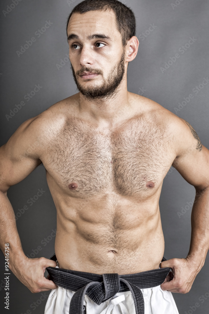 Obraz premium Portrait of young shirtless man posing