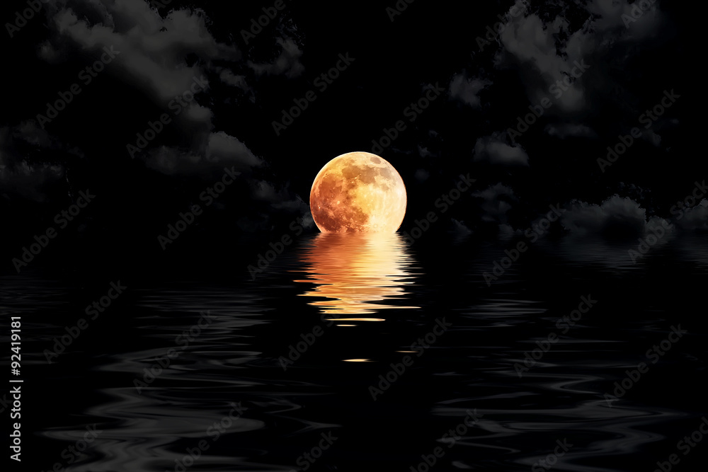 Fototapeta premium dark red full moon in cloud with water reflection closeup showin