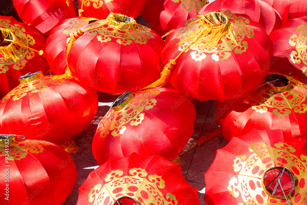 Pile of red chinese lantern on the floor in sunlight Pile of red chinese lantern on the floor in sunlight