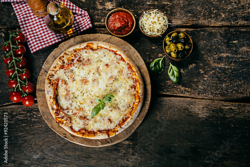 Home baked margarita pizza with ingredients photo