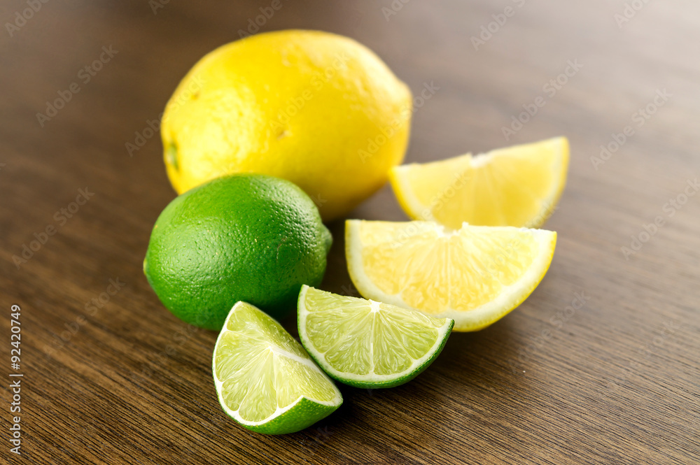 Delicious sour citrus fruits against rustic dark oak Delicious sour citrus fruits against rustic dark oak