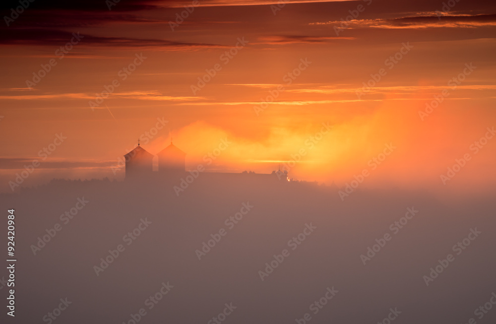 Sunrise over misty Tyniec abbey in Krakow, Poland