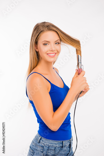 Happy pretty girl twisting her hair