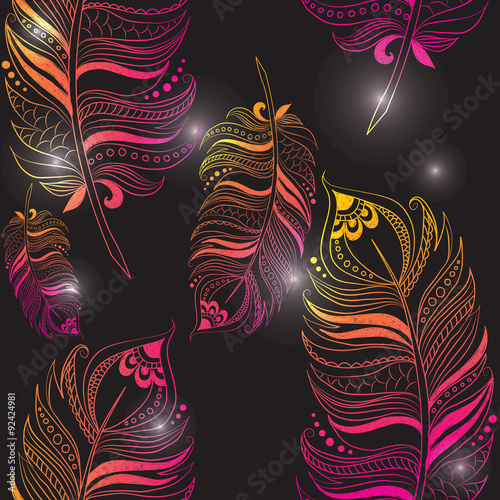 Texture with bright feathers on a black background