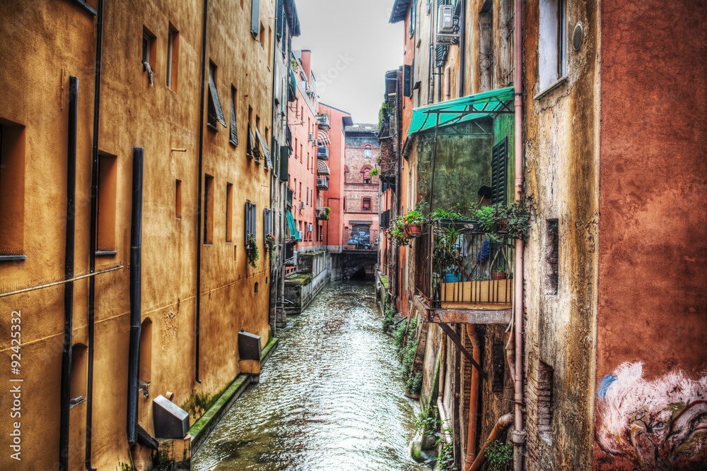 narrow canal in Bologna downtown