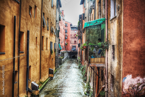 narrow canal in Bologna downtown photo