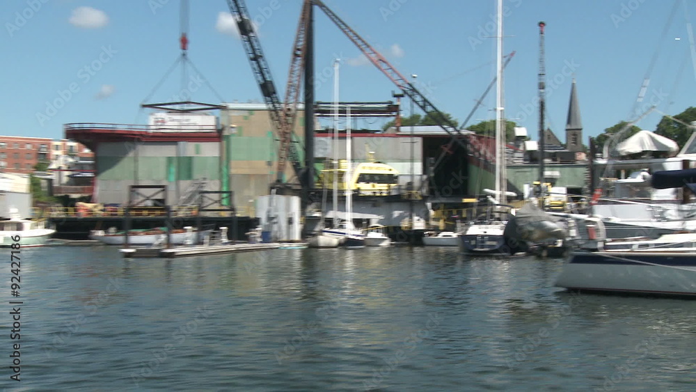 Boats docked at marina.