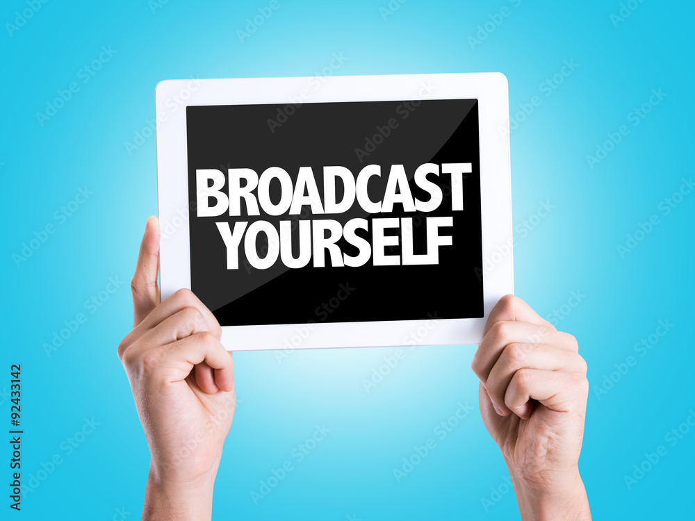 Tablet pc with text Broadcast Yourself with blue background Tablet pc with text Broadcast Yourself with blue background