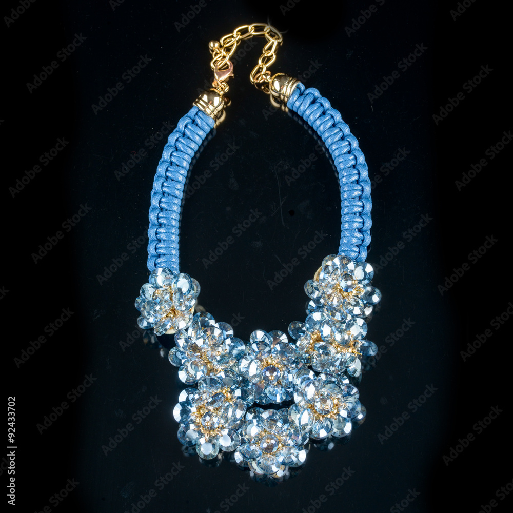 Fototapeta premium necklace on a black background