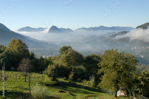 View to the bay of Lugano with fog