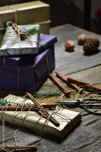 Stylish & hip christmas gifts box presents on the old wooden table