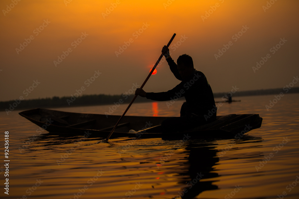 Fisherman action when fishing during sunset