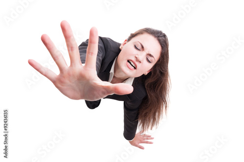 Business woman making despair gesture by crawling on the floor