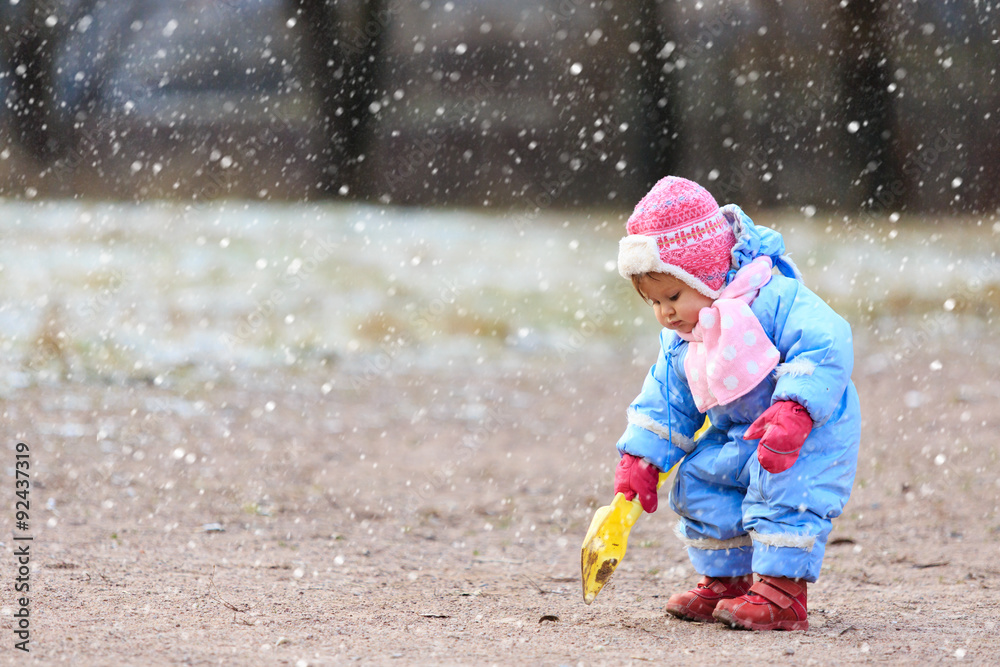 little girl play in snow winter park little girl play in snow winter park