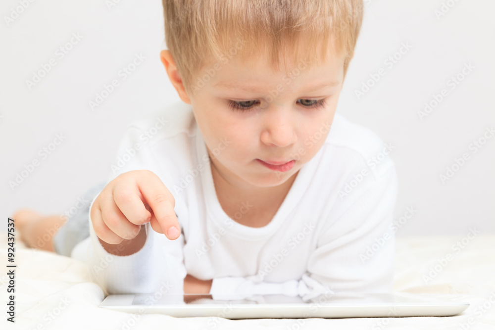 Little boy with touch pad, early education Little boy with touch pad, early education