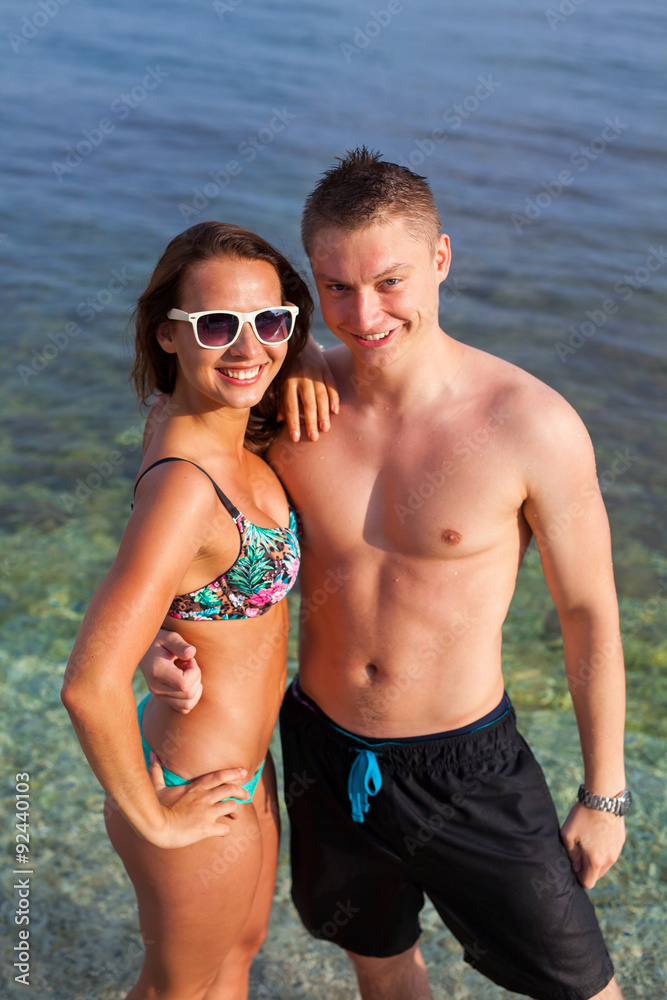 A couple standing on the coast of the sea and having fun. A couple standing on the coast of the sea and having fun.
