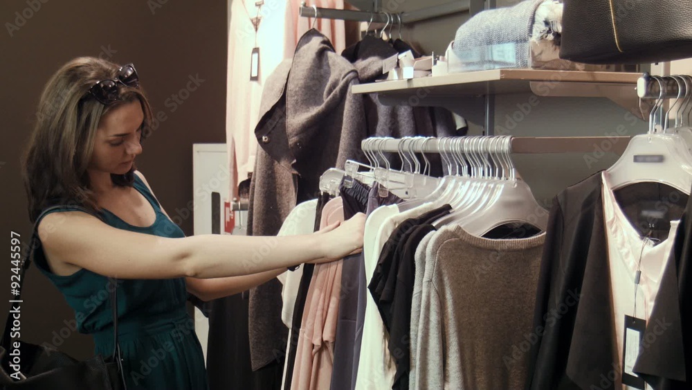 Girl is looking for a suitable skirt and blouse