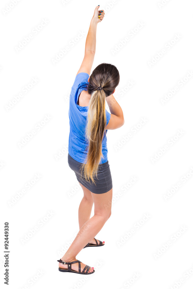 back view of standing girl pulling a rope from the top or cling back view of standing girl pulling a rope from the top or cling