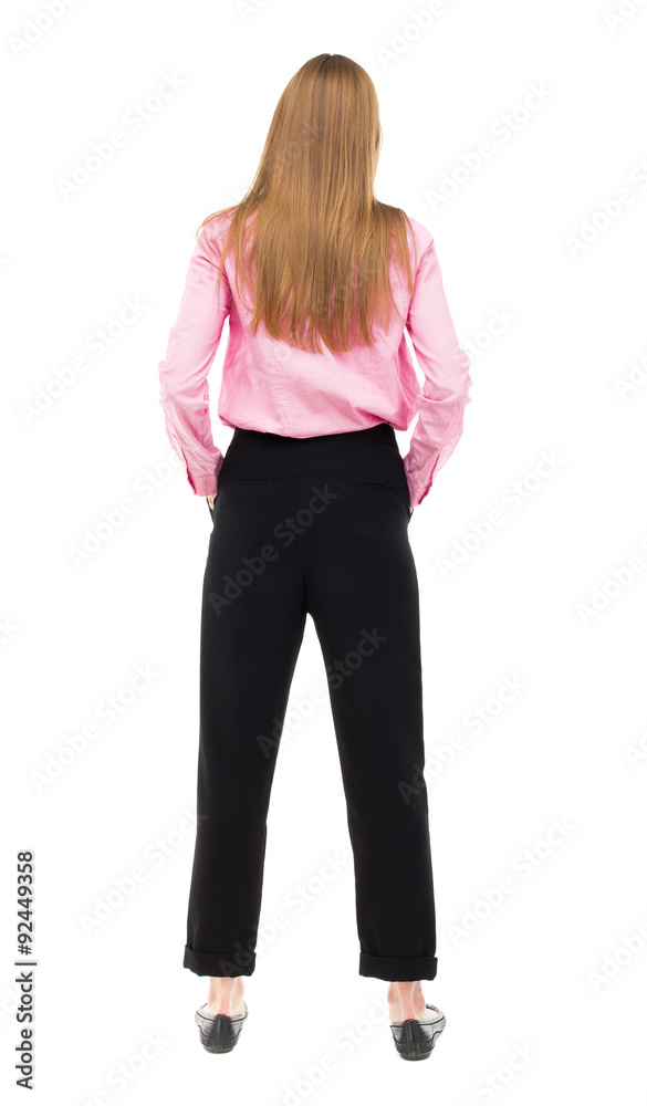 Fototapeta premium back view of standing young beautiful woman.