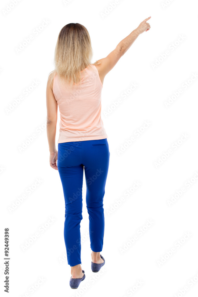 Back view of pointing woman. Back view of pointing woman.