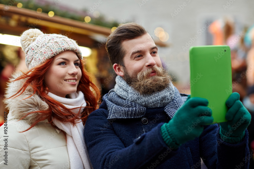 couple taking selfie with tablet pc in old town couple taking selfie with tablet pc in old town