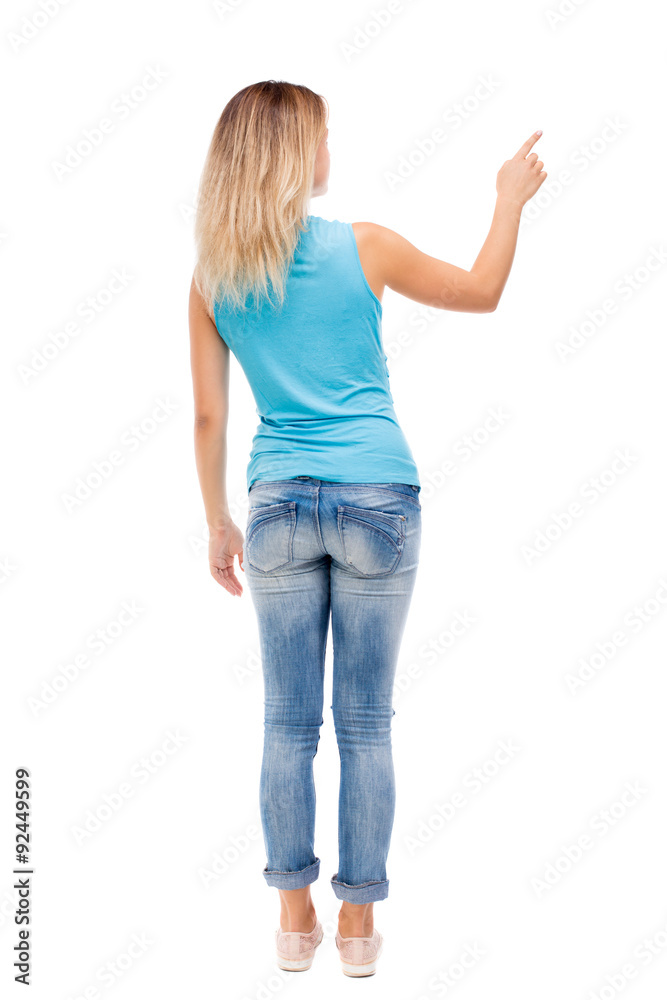 Back view of pointing woman. Back view of pointing woman.