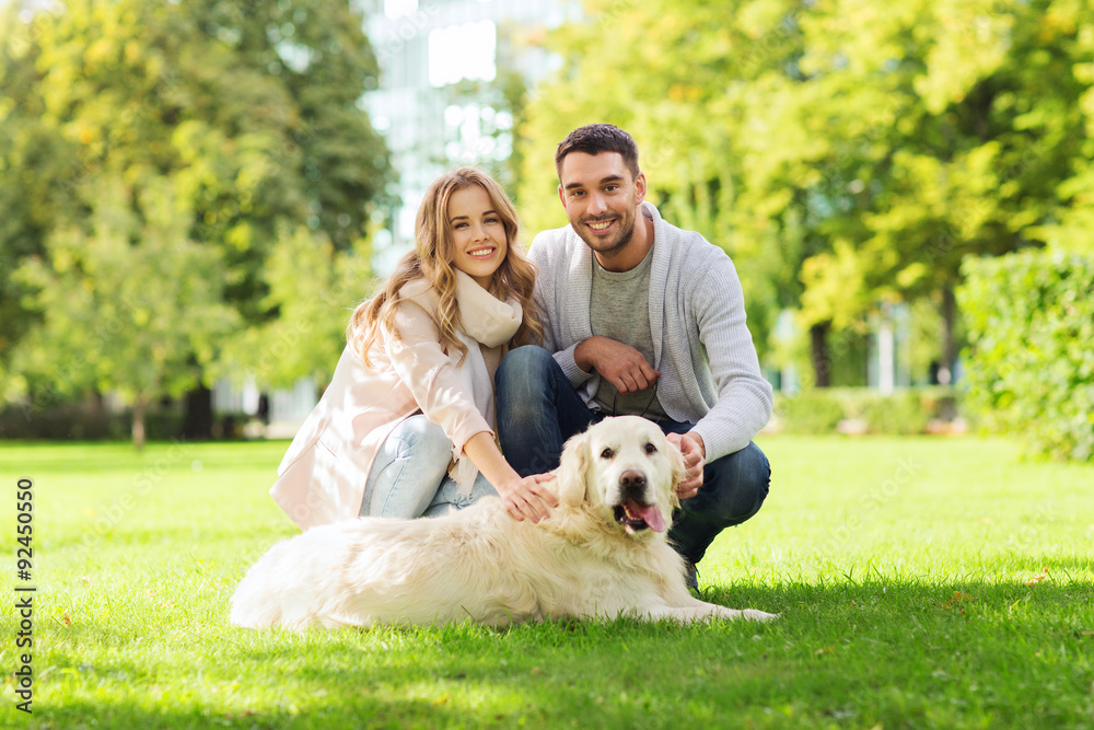 happy couple with labrador dog walking in city happy couple with labrador dog walking in city