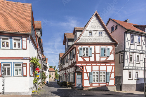 old timbered medieval houses in Butzbach, Germany under blue sk