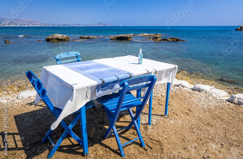 Blue restaurant table on the sea coast