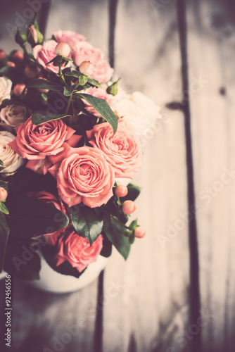 Bouquet of roses in vintage coffee pot