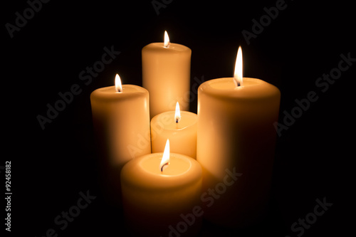 five Candles on black background