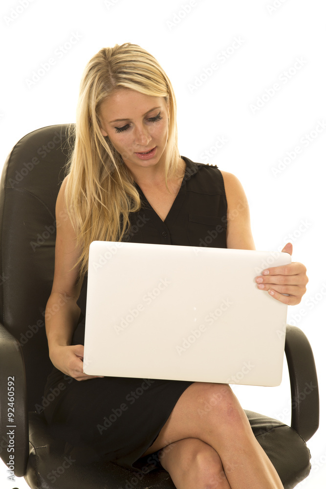 Naklejka premium blond woman black business dress sit with laptop look down