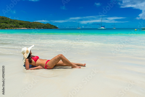 Girl at Anse Lazio - Paradise beach in Seychelles, tropical island Praslin