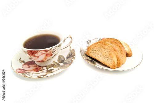 crackers and cup of tea on white