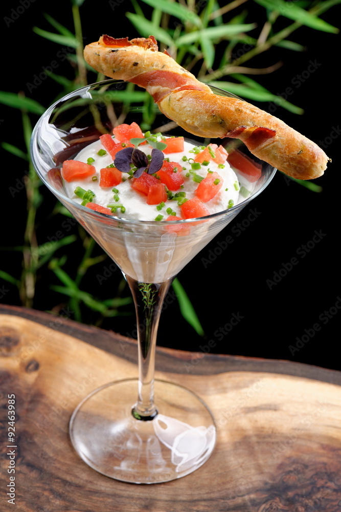 Fine dining, shrimp cocktail with cream, tomato and grissini stick with bacon Fine dining, shrimp cocktail with cream, tomato and grissini stick with bacon