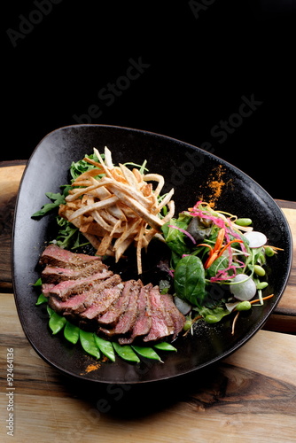 Lemongrass grilled beef steak with snow peas and taro potatoes