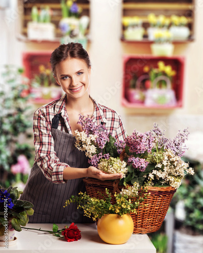 Young florist shop flowers photo