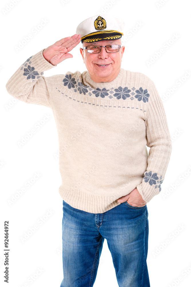 Happy old senior man smailing and saluting with a boat captain c