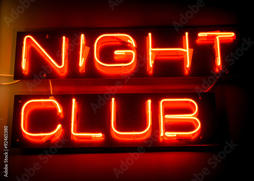 Nightclub neon sign hanging on the wall