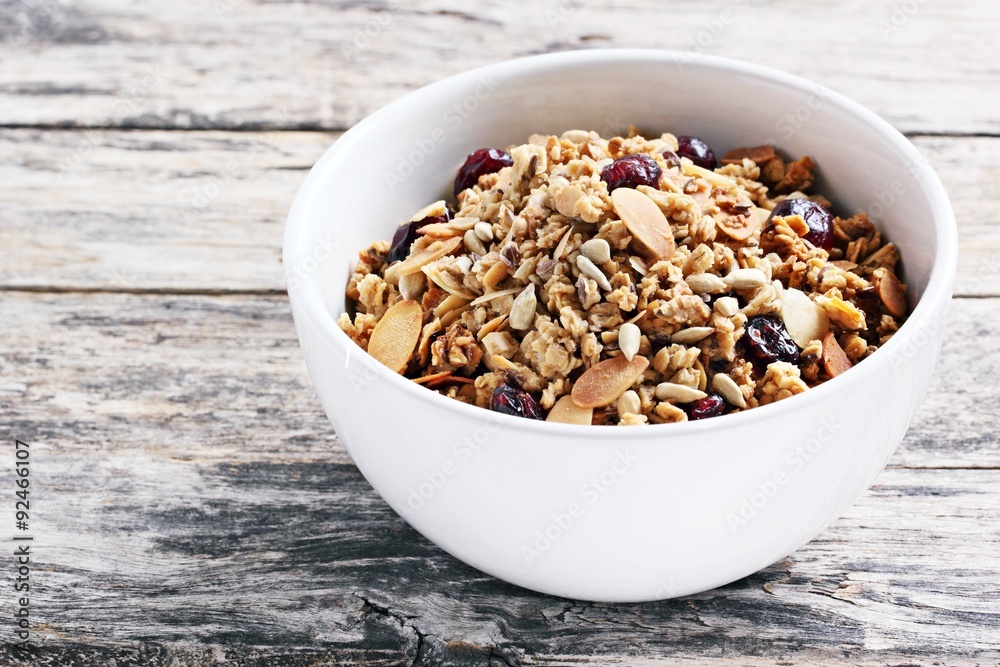 Homemade granola with nuts and dried cranberry.Selective focus Homemade granola with nuts and dried cranberry.Selective focus