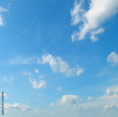 light cumulus clouds in the blue sky