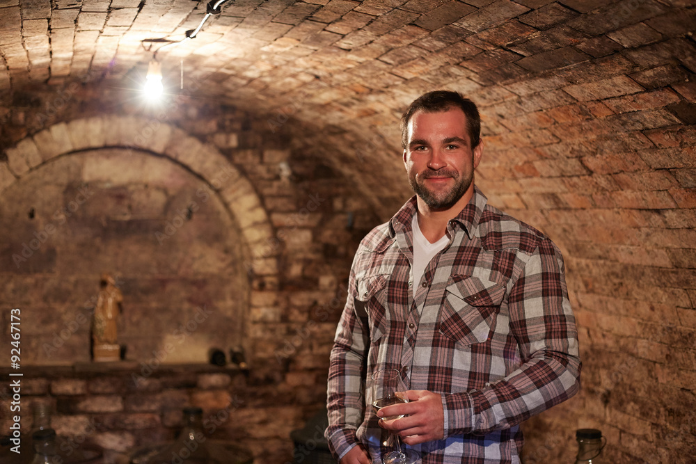 Man in wine cellar