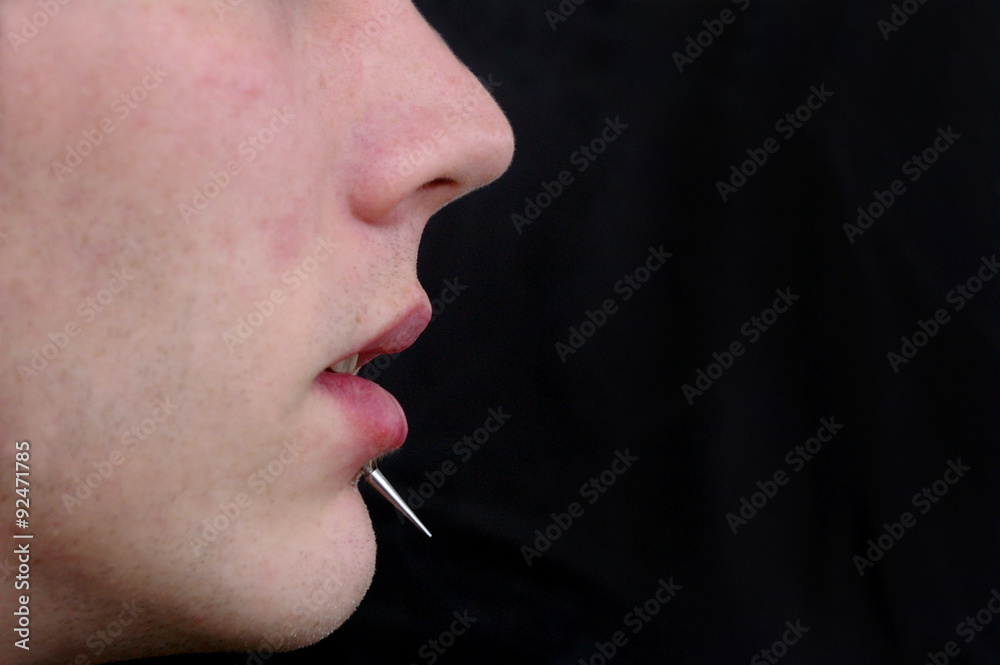 Obraz premium A close up on a mans face with a piercing