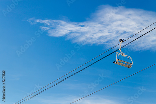 ski lifts on the background of sky with clouds