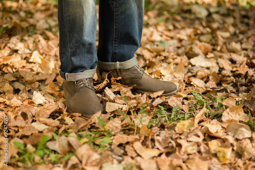 Man s legs in autumn season