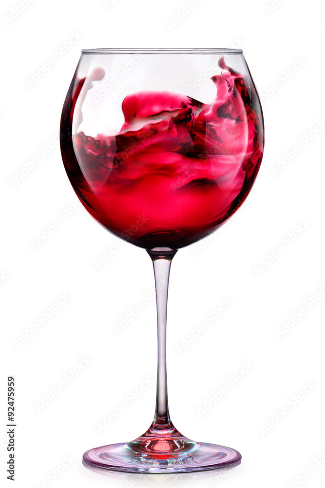 Glass of red wine with splashes isolated on a white Glass of red wine with splashes isolated on a white