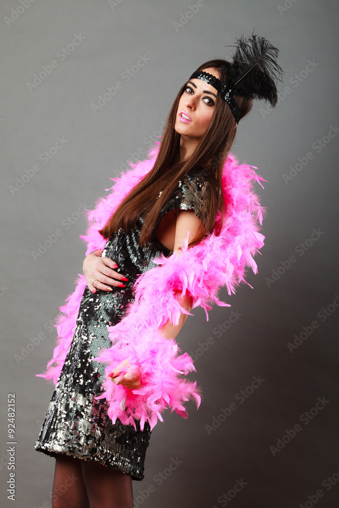 Girl pink plume and black feather on head. Carnival. Girl pink plume and black feather on head. Carnival.