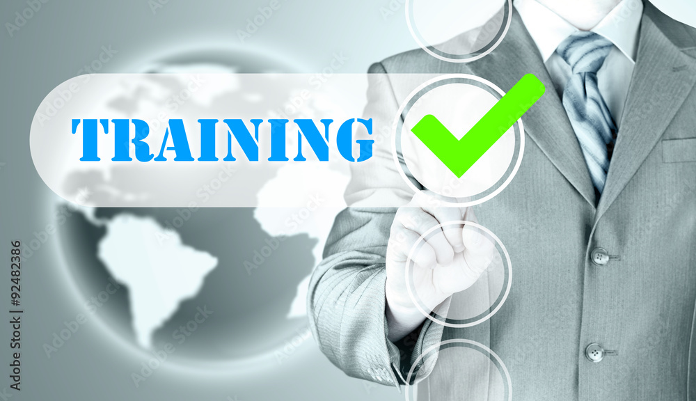 Businessman pressing touch screen interface training checkbox Businessman pressing touch screen interface training checkbox
