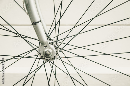 close up of bicycle wheels process in vintage retro style